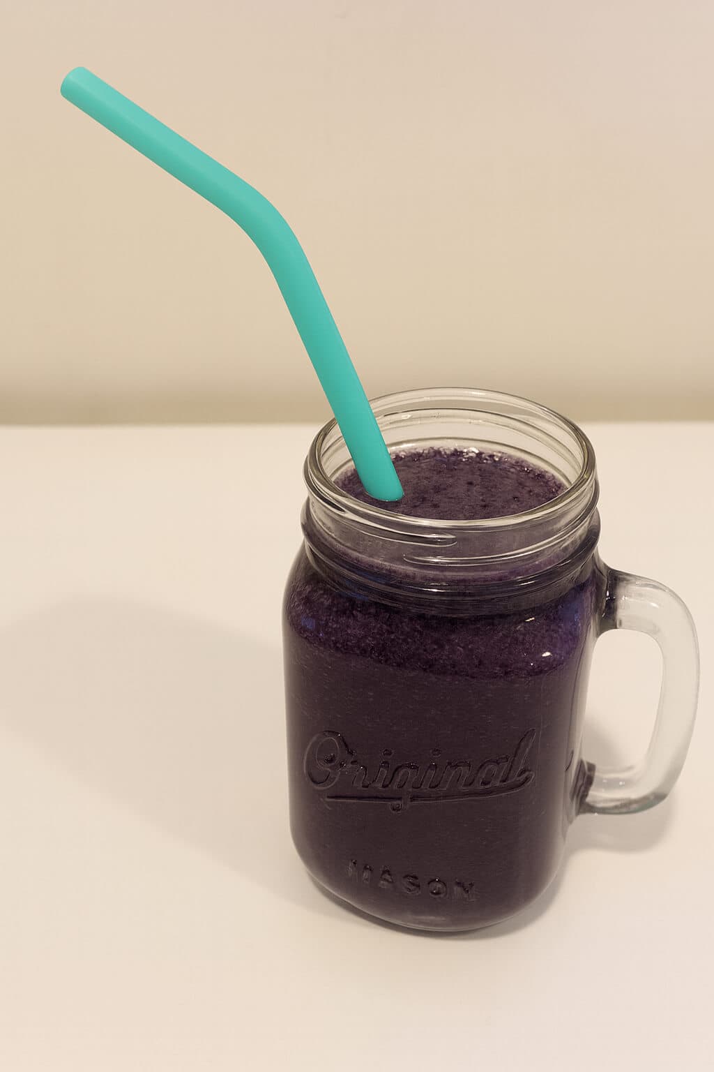 Vegan blueberry maple smoothie with oat milk, protein, spinach, and maple syrup. A healthy breakfast or pre-workout snack.